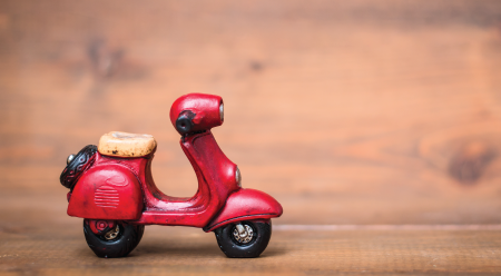 toy vespa with rustic look on wood